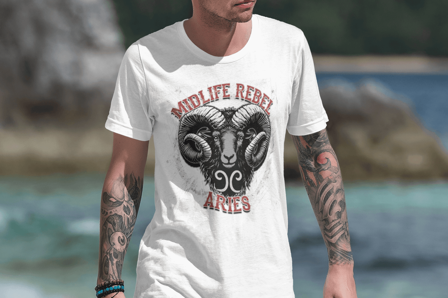 Aries Midlife Rebel Clothing Club tattooed man walking on the beach