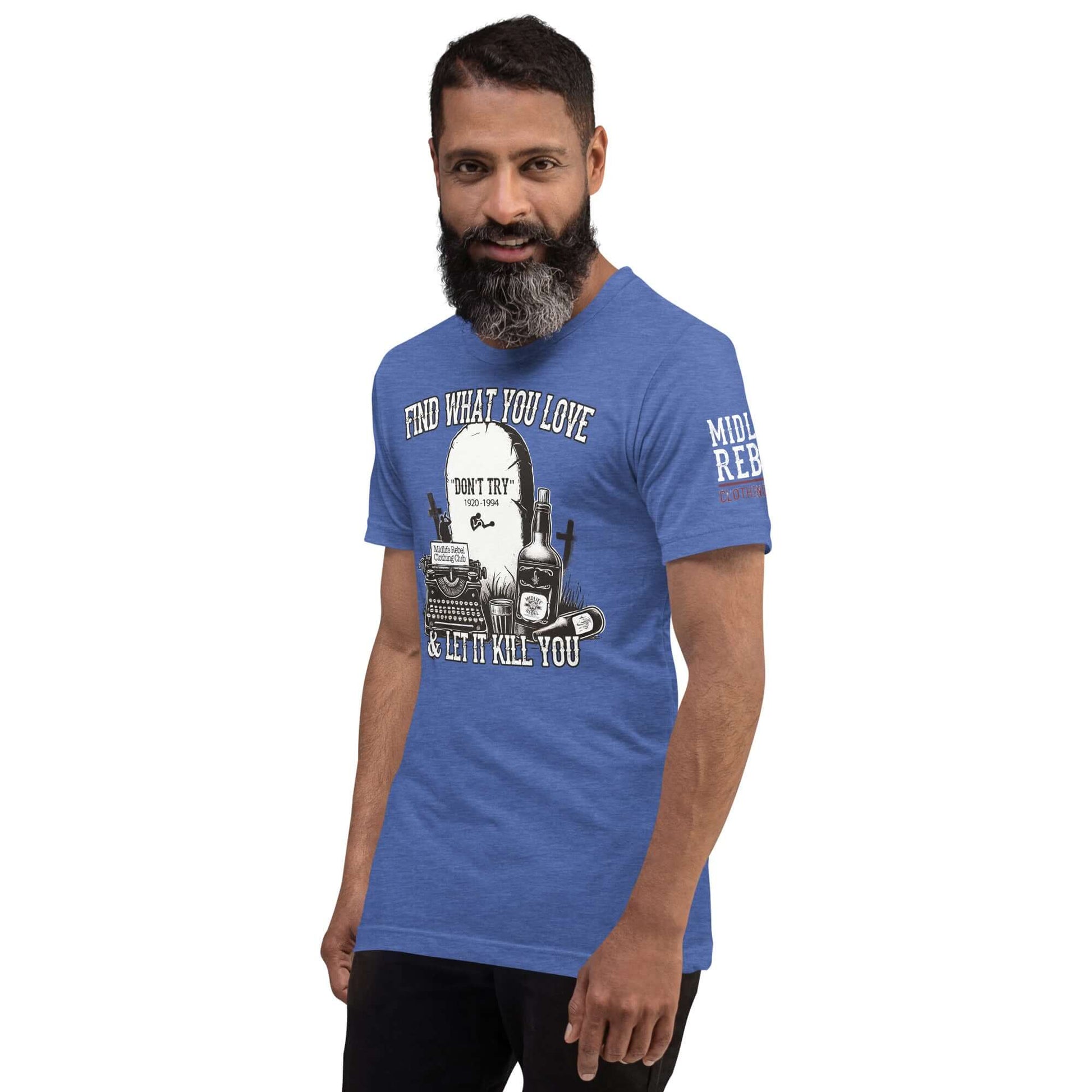 Man wearing blue Bukowski tribute shirt featuring tombstone, whiskey bottles, and typewriter from Midlife Rebel Collection.