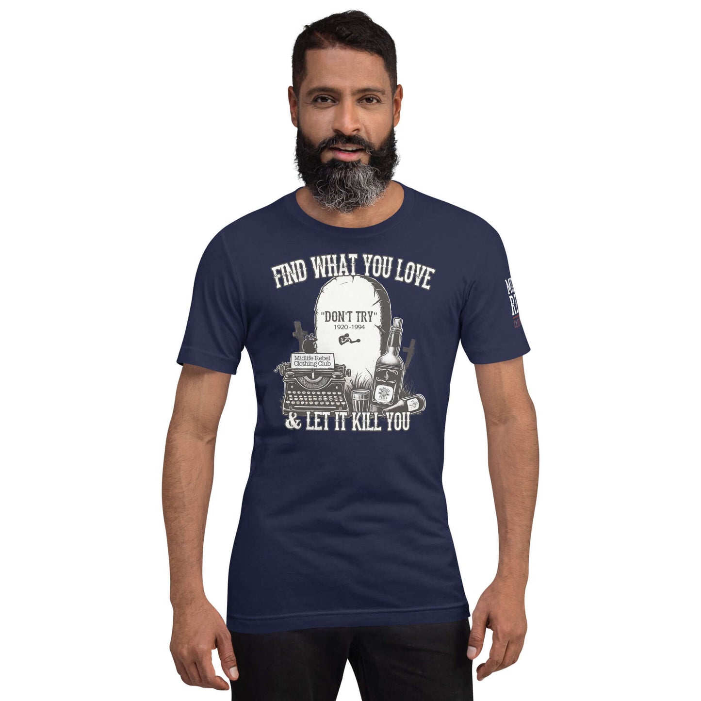 Man wearing navy "Find What You Love & Let It Kill You" shirt from the Midlife Rebel Bukowski Collection with tombstone and typewriter design.