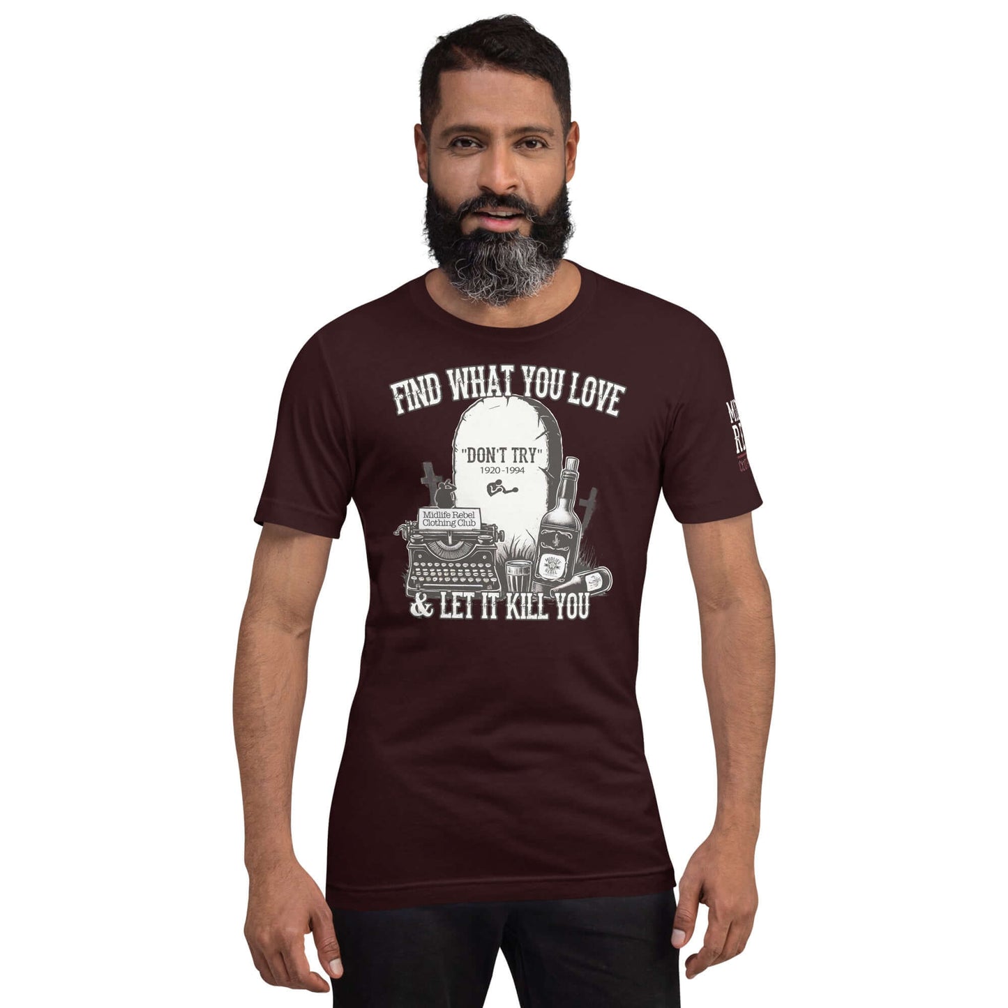 Man wearing a "Find What You Love & Let It Kill You" Bukowski shirt featuring tombstone, whiskey bottles, beer, and typewriter design.
