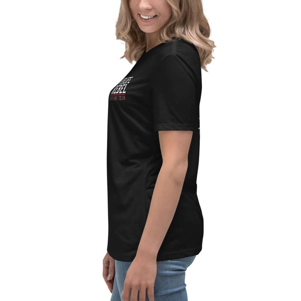 Woman wearing black "Wear Your Scars With Pride" Midlife Rebel T-shirt, side view, paired with jeans.