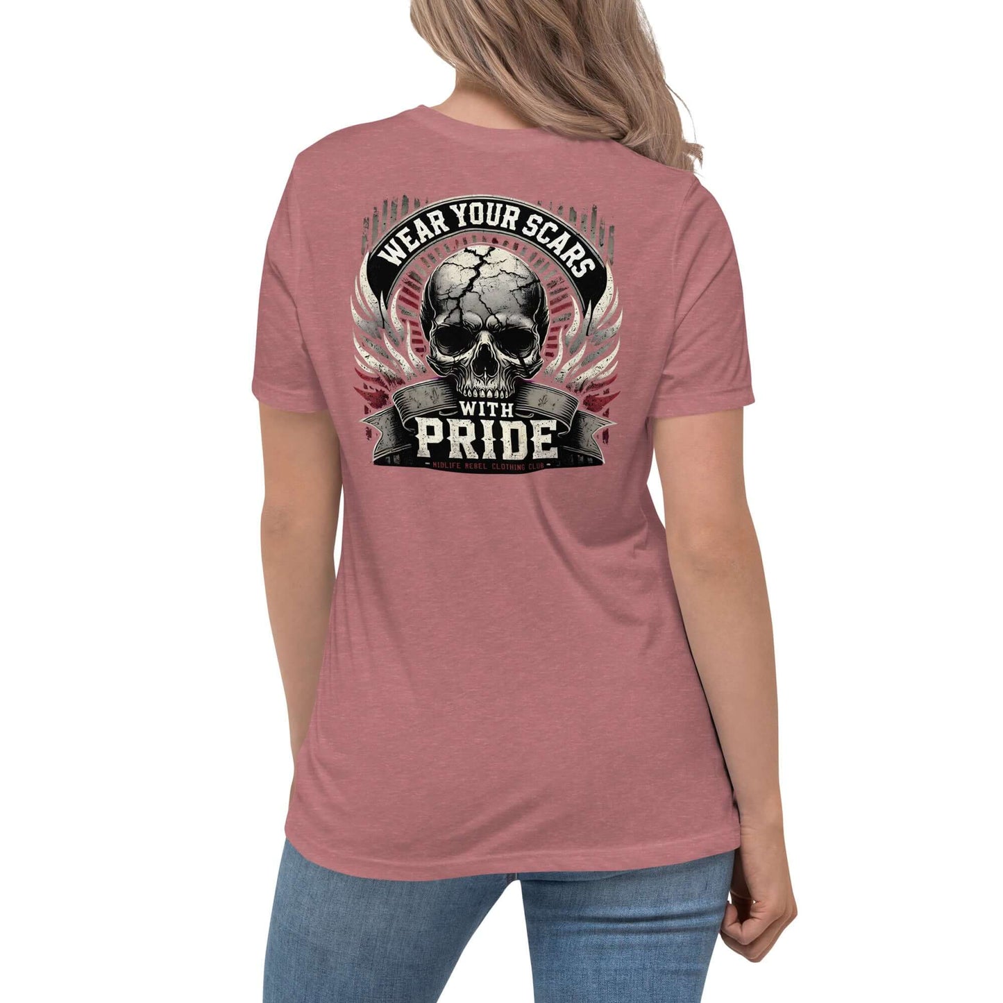 Woman wearing "Wear Your Scars With Pride" t-shirt with skull design and wings, representing resilience and strength.