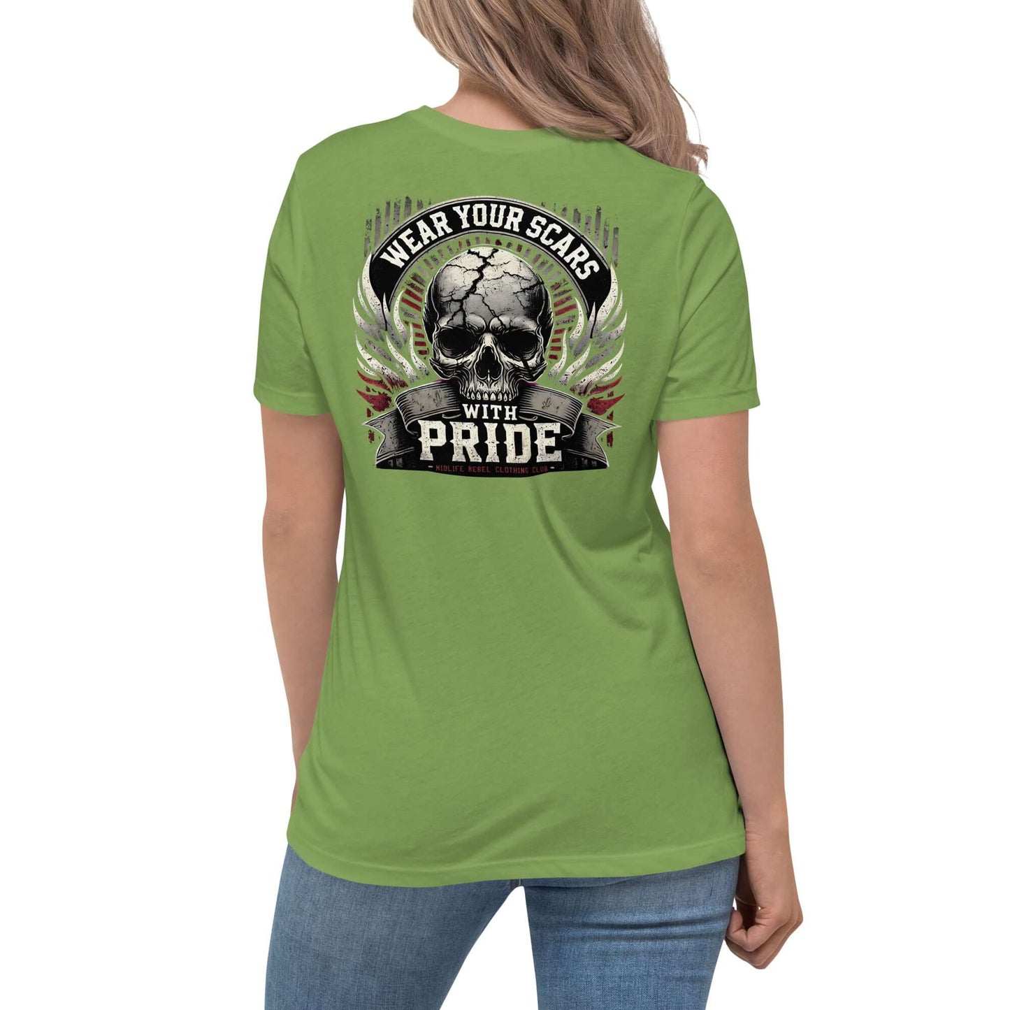 Woman wearing a green Midlife Rebel T-shirt with "Wear Your Scars With Pride" skull design on the back.