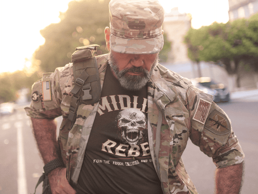 Midlife-Rebel-Clothing-Club-Skull-veteran-in-uniform-wearing-a-t-shirt-mockup-walking-down-the-street