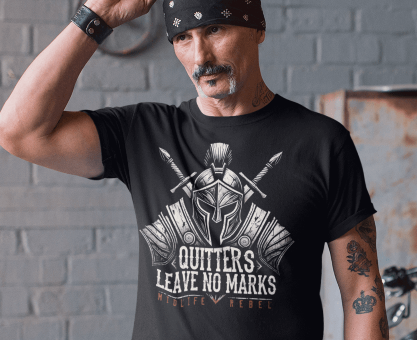 Quitters Leave No Marks t-shirt on a biker with a thick mustache