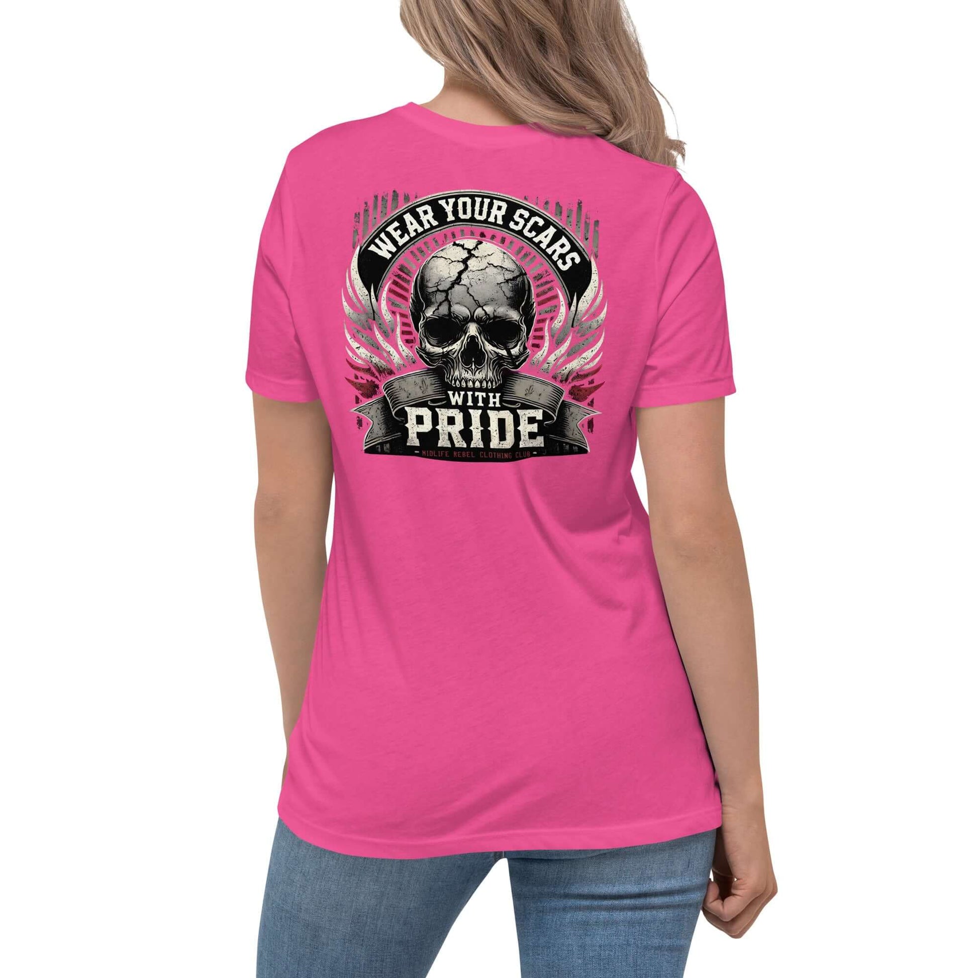 Woman wearing pink t-shirt with "Wear Your Scars With Pride" skull design on back, symbolizing resilience and empowerment.